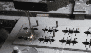 Figure 9 Positioning the workpiece onto the fixture plate using locating pins