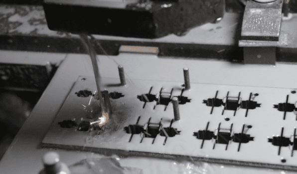 Figure 9 Positioning the workpiece onto the fixture plate using locating pins